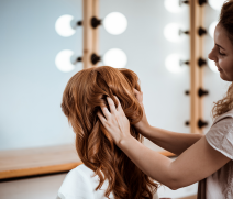 female-hairdresser-making-hairstyle-redhead-woman-beauty-salon