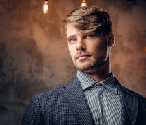 portrait-stylish-maledressed-suit-grey-background